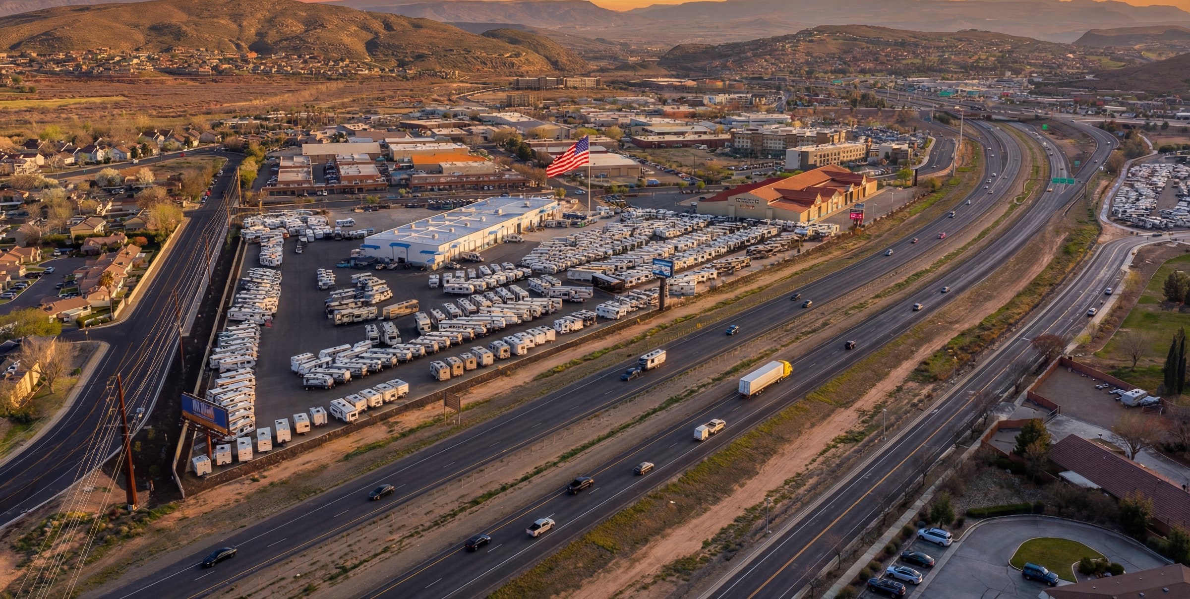 Aerial view at sunset of the Nielson RV Supercenter alongside Interstate 15 in St. George, Utah
